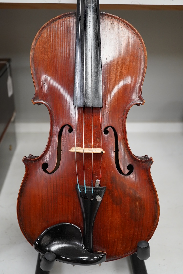 A cased late 19th century German Mittenwald violin with lion’s head scroll, and two bows, Ivory submission ref: RP2E5HT1